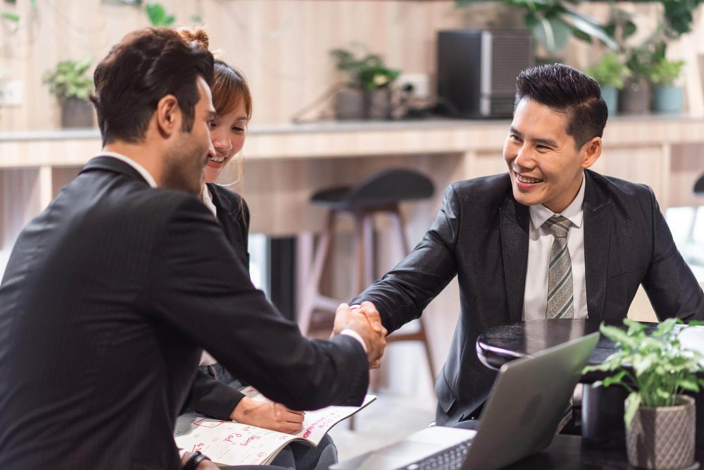 group-diverse-business-people-successful-teamwork-working-together-with-laptop-computer-office (1)